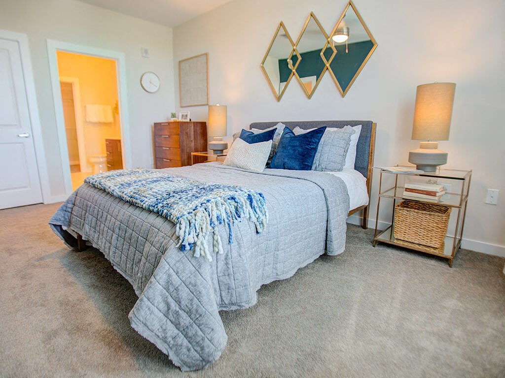 Bedroom with bed and nightstand at Caroline Charleston SC