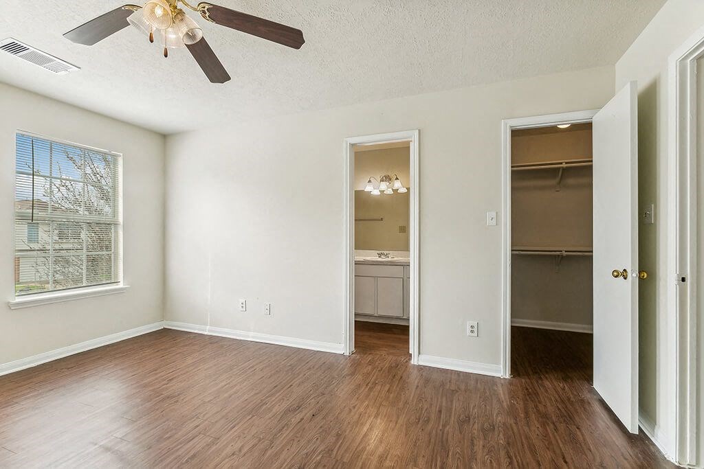Bedroom with ceiling fan at Sterling Green and Sheldon Ranch in Channelview TX