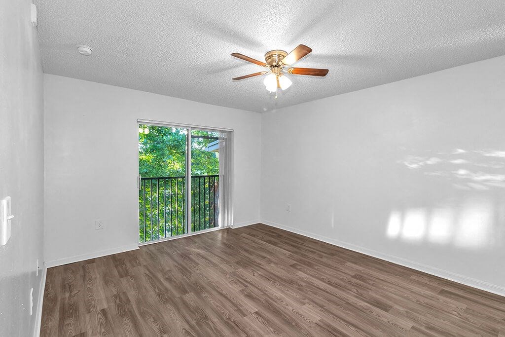 Bedroom with ceiling fan at Cedar Grove Apartments in Miami Gardens FL