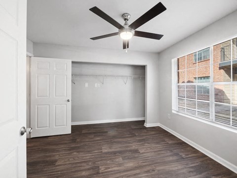 Bedroom with ceiling fan at Forest Creek Apartments in Houston TX