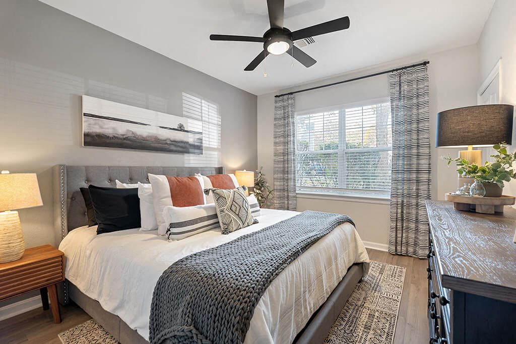 Bedroom with ceiling fan at River Pointe at Den Rock Park in Lawrence MA