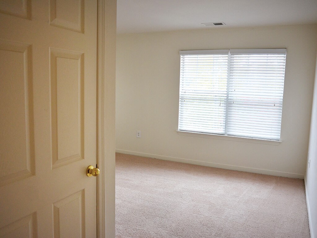 Bedroom at Whispering Oaks Apartments in Portsmouth VA