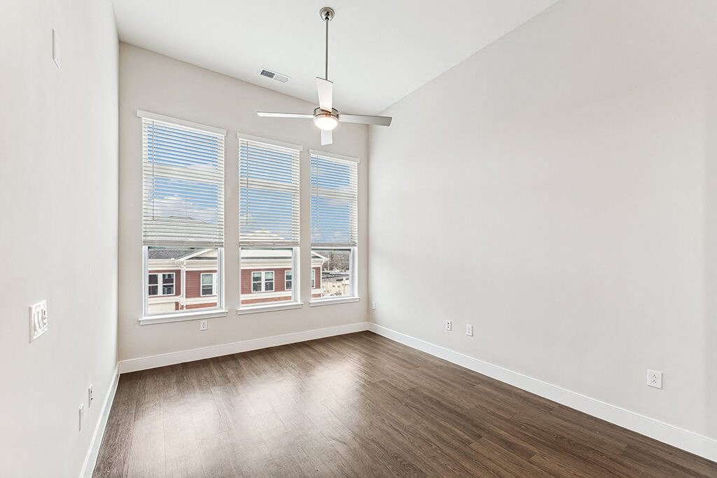 Bedroom with large windows at The Moxley in Fairfax VA