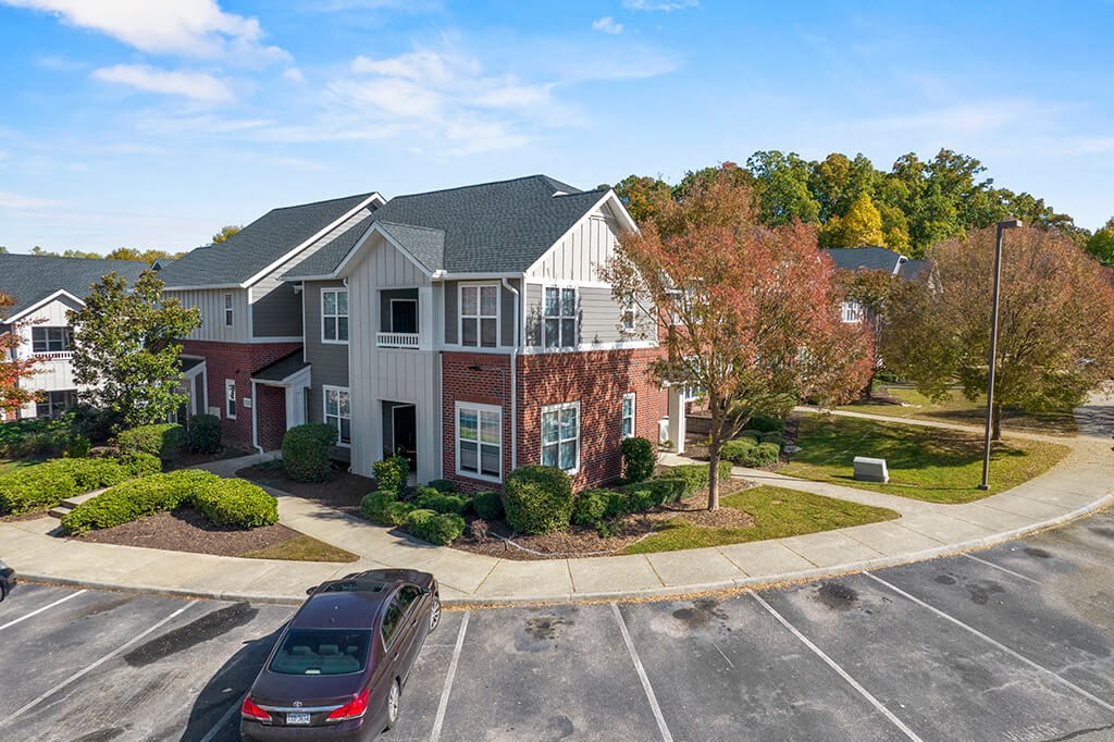 Building exterior and parking at Grand Oaks in Chester VA