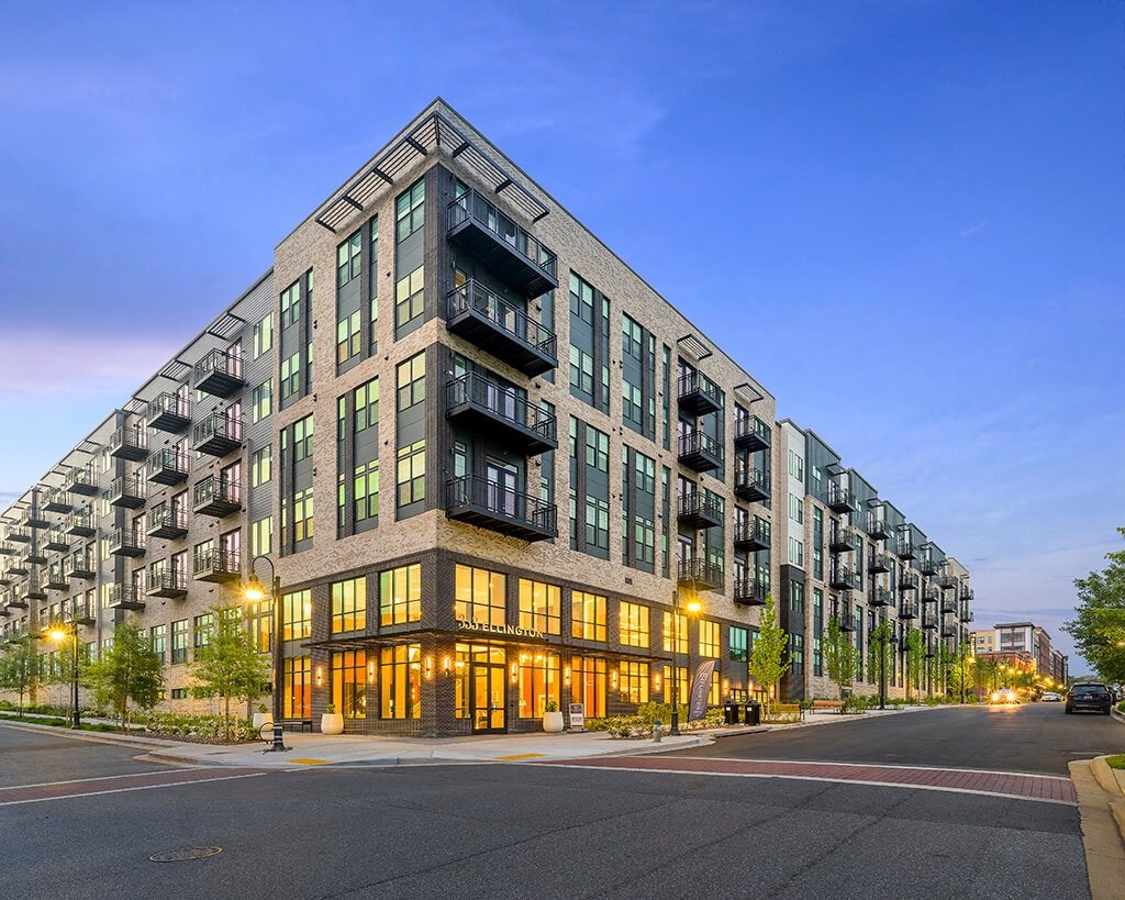 Building exterior at dusk at 333 Ellington Apartments in Gaithersburg MD