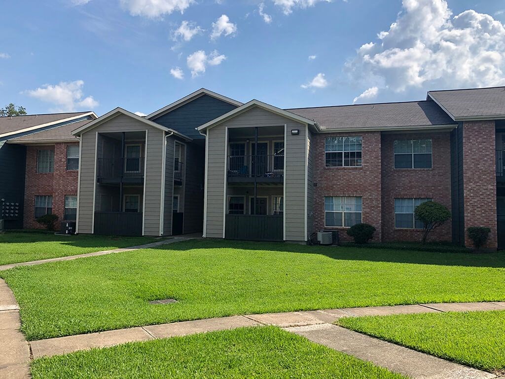 Building exterior lawn at Forest Creek Apartments in Houston TX