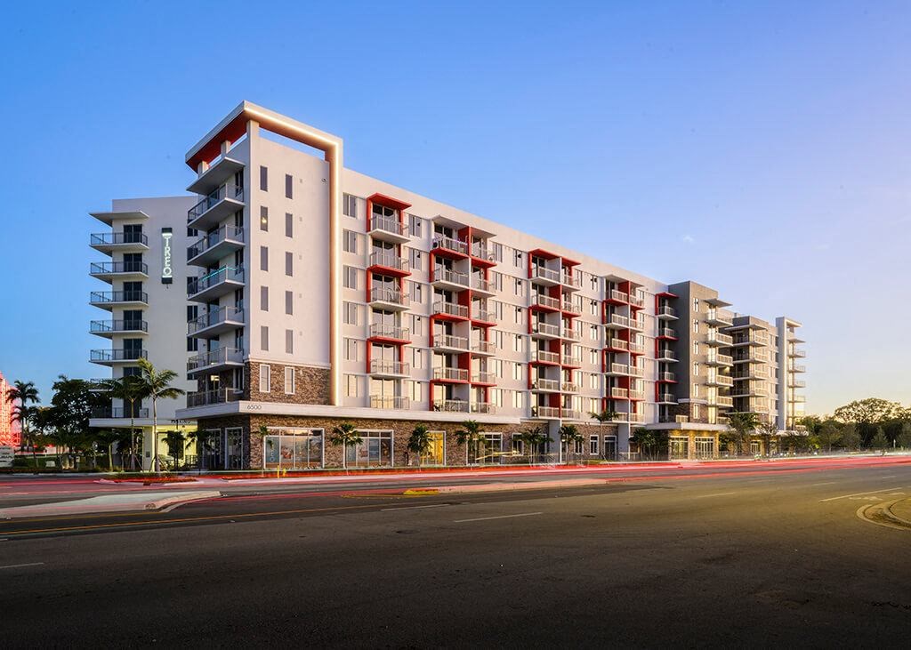 Building exterior at dusk at Treo Apartments in Fort Lauderdale FL