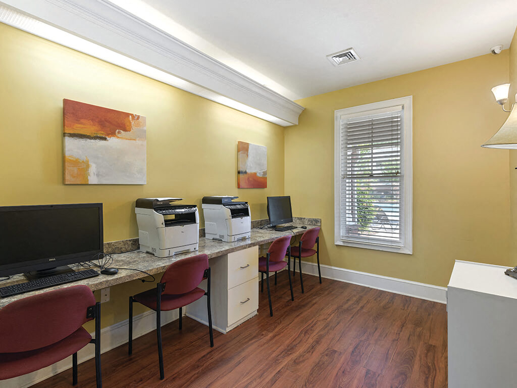 Business center with computers and printers at Falls Pointe Apartments in Durham NC