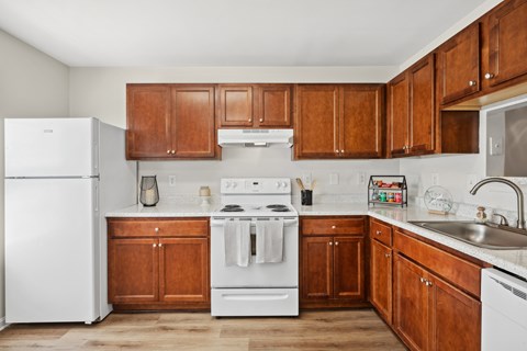 Kitchen with wood cabinets at Riverwoods Apartments in Woodbridge VA