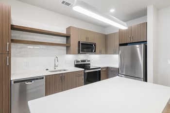 Apartments for Rent in Herndon VA - Spacious Kitchen Featuring Convenient Amenities Such As Dishwasher, Stove, and Microwave - Photo Gallery 4