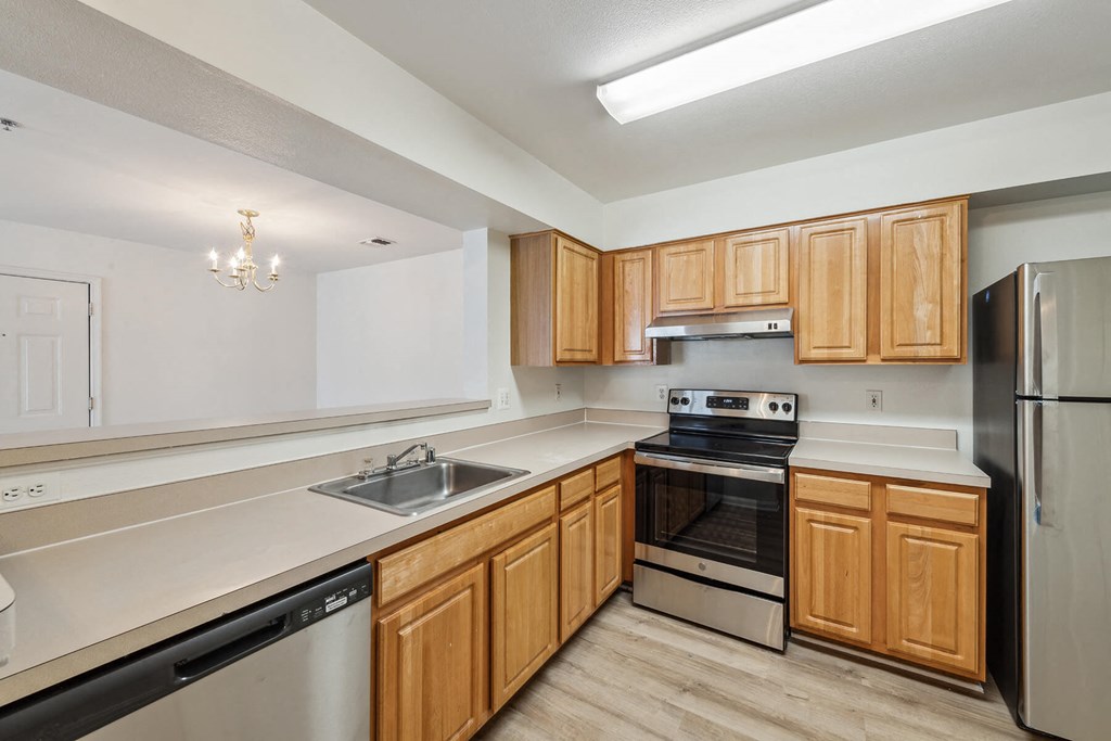 Kitchen with light wood cabinets at England Run Apartments in Fredericksburg VA
