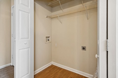 a bedroom with a closet and a white door