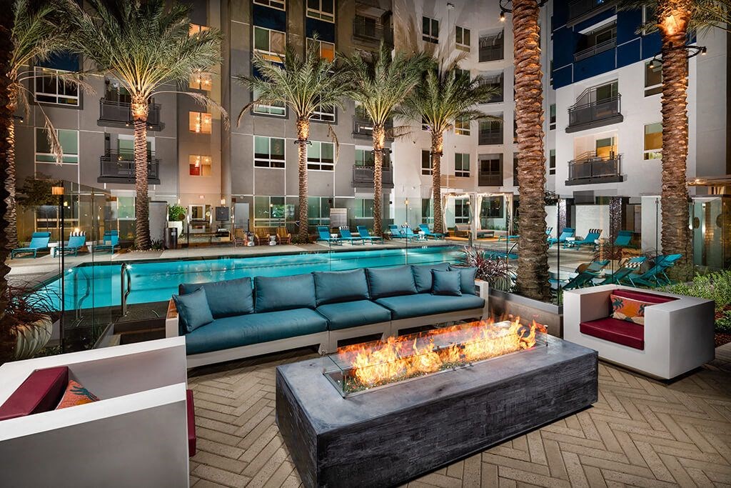 Clubroom Jive Patio Fire Table Dusk Pool Luminescence at Chroma Apartment Homes in Ca