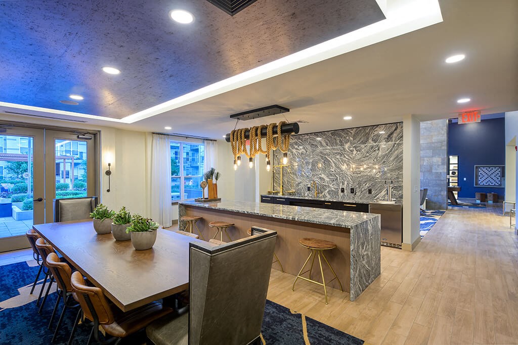 Clubroom Kitchen and Dining Table at Vero Apartments in Chelsea MA