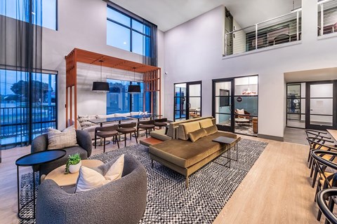 A modern living room with a large sofa and a coffee table.