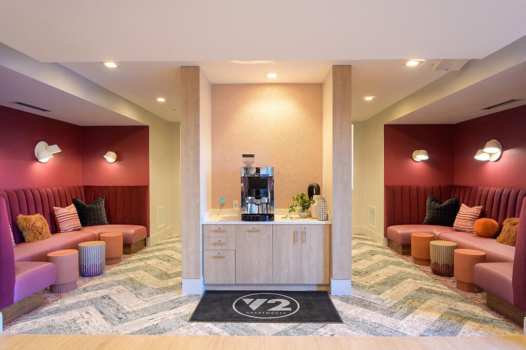 a lobby with couches and a coffee bar