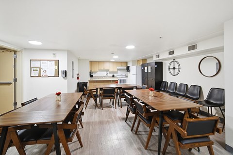 A conference room with a long table and chairs.