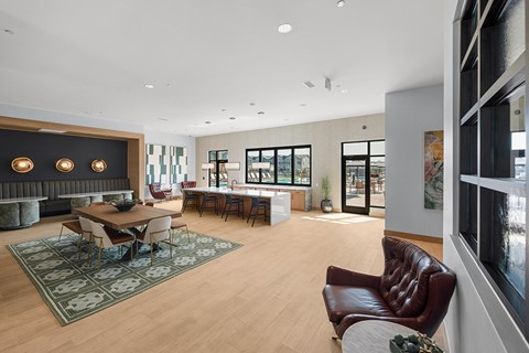 A modern living room with a brown leather chair and a fireplace.