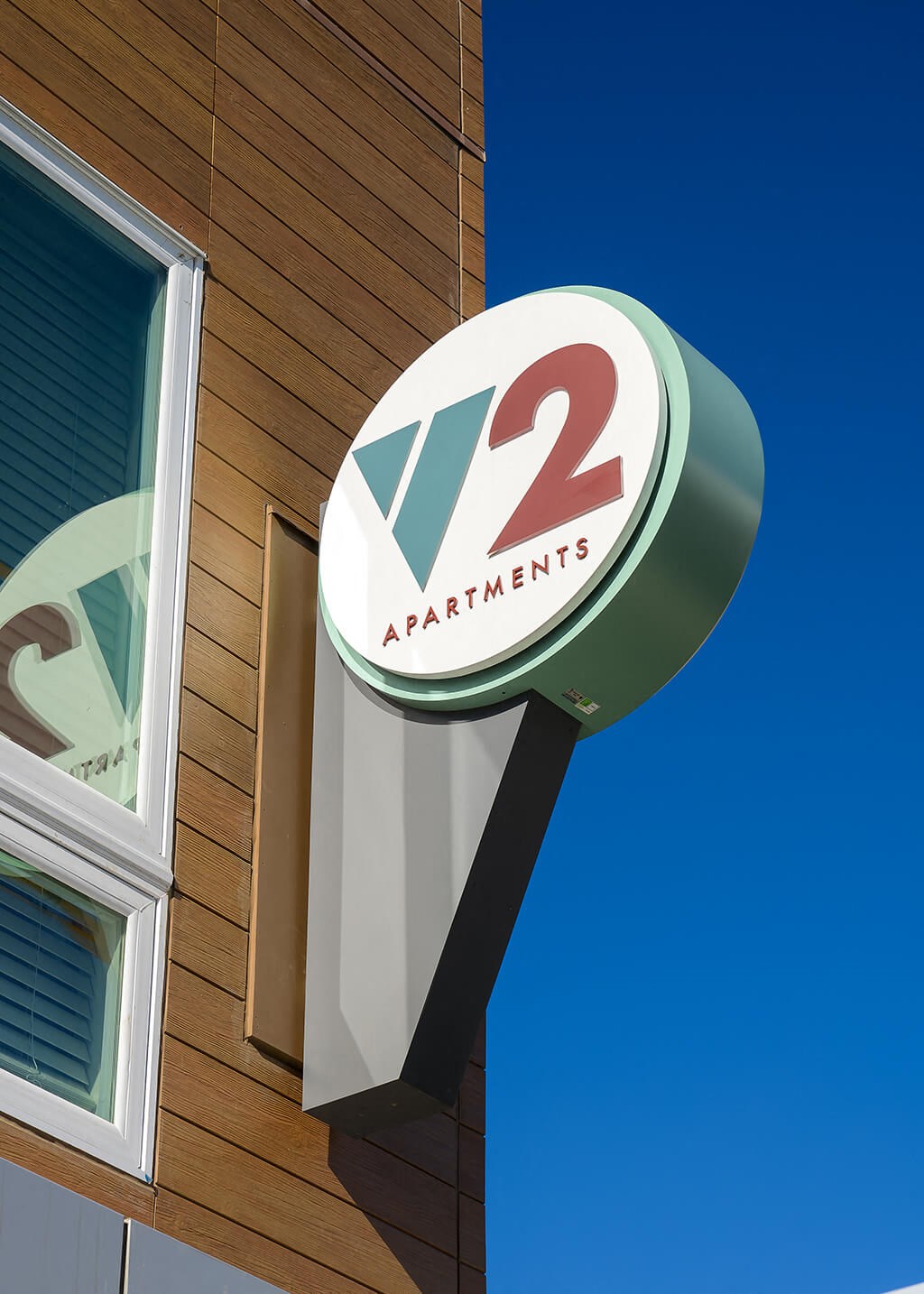 a sign on the side of a building for a2 apartments