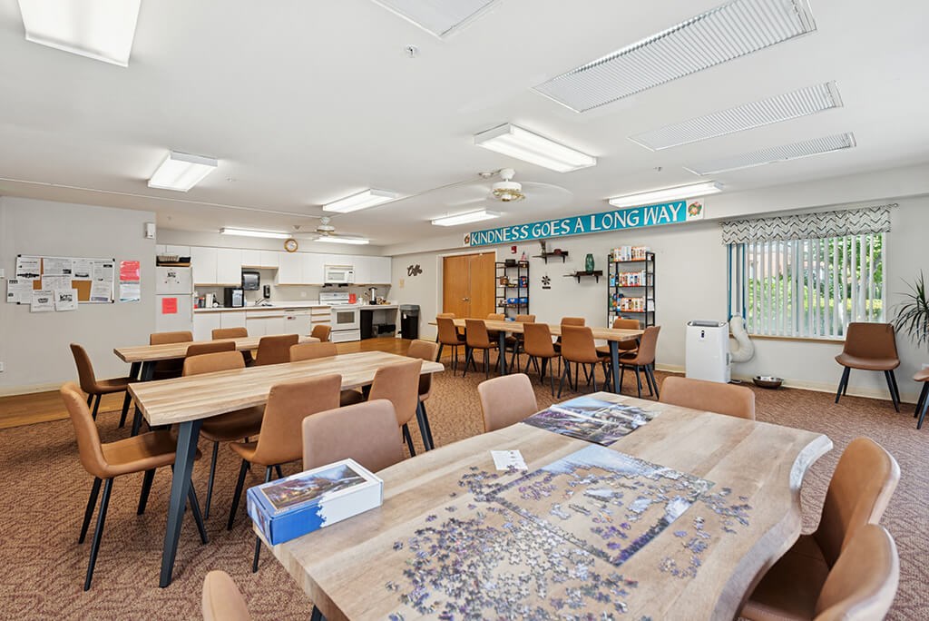 Community room seating area at Lakewood Meadows Apartments in Lakewood WA