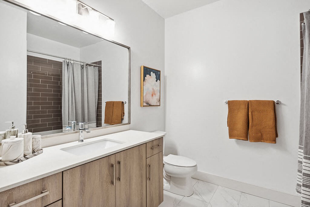Cool Gloss Design Package Bathroom Vanity at The Quill Apartments in Milford, MA