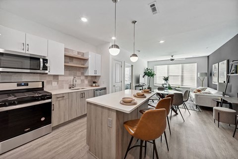 Cool Gloss Design Package Kitchen and Living Room at The Quill Apartments in Milford, MA