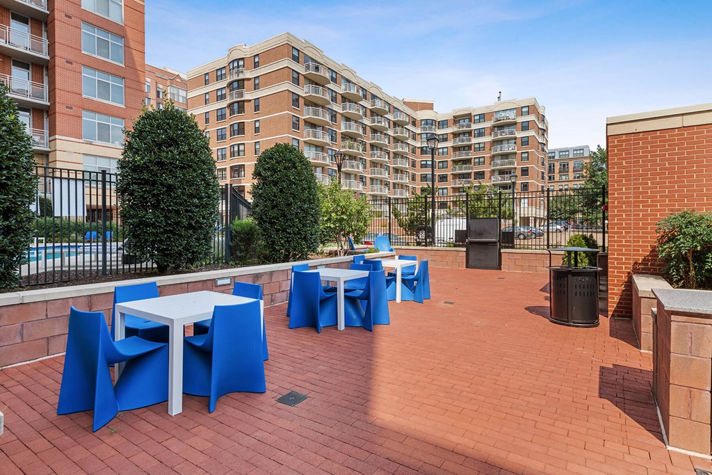 Courtyard tables and chairs at Bradley Braddock Road Station Apartments in Alexandria VA