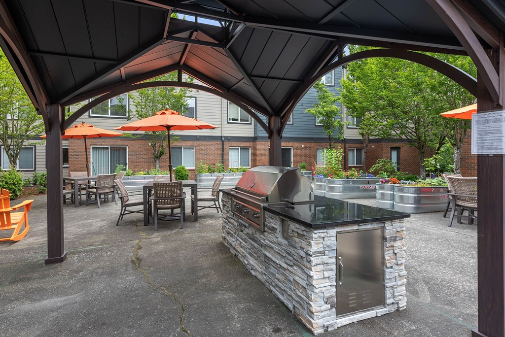 Senior Apartments Federal Way - Brand-New Grilling Area In A Renovated Courtyard With Plenty Of Seating And Tables