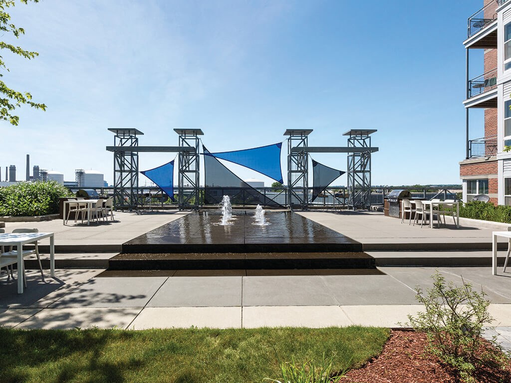Courtyard reflecting pool at Axis Admirals Hill Apartments in Chelsea MA