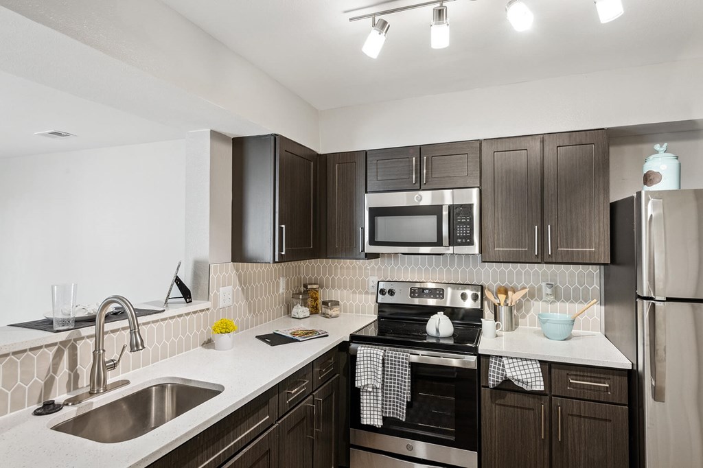 Kitchen with dark cabinets at England Run North in Fredericksburg VA