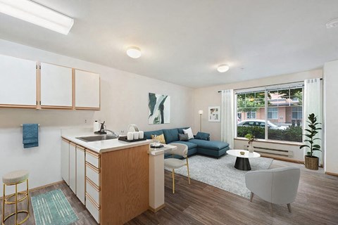 a living room with a kitchen and a couch