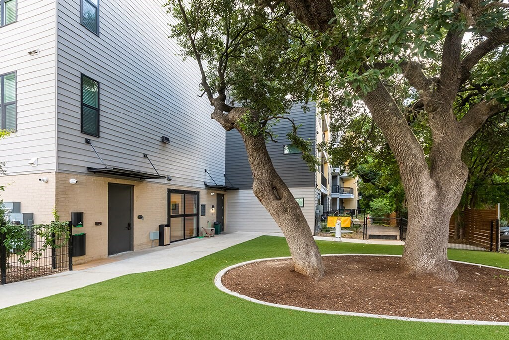 our apartments have a spacious courtyard with trees and grass