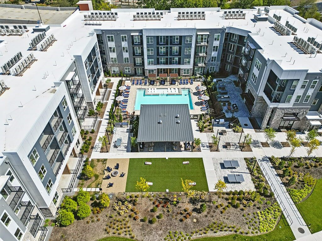 Drone view of pool and courtyard at Station 316 Apartments in Woburn MA