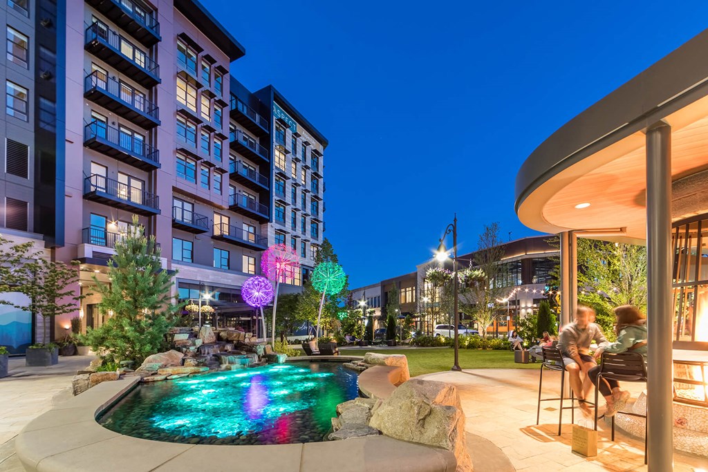 Exterior Building Cinema Courtyard at Dusk at Aspect at Totem Lake Apartments in Kirkland WA