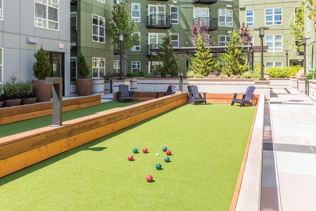 Exterior Courtyard Bocce Ball Lawn Game in Progress at Aspect at Totem Lake Apartments in Kirkland WA