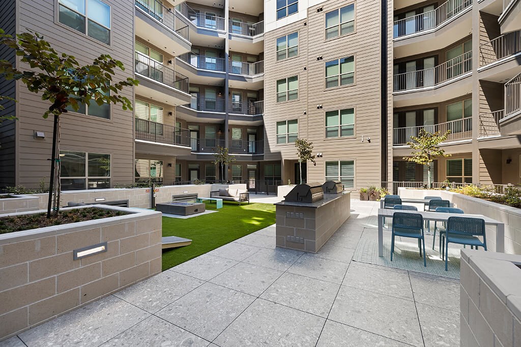 Exterior courtyard grilling at East Bend Apartments in Houston TX