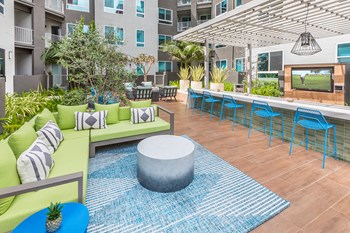 Exterior Courtyard Spark Seating and Grilling Area at Aura Apartment Homes in Orange CA - Photo Gallery 27