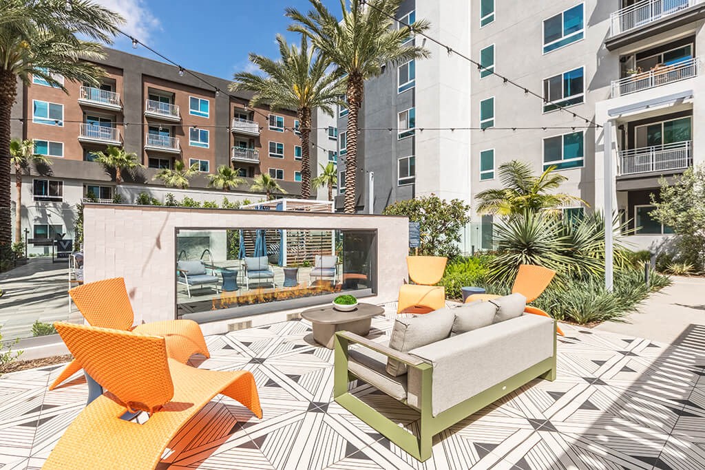 Exterior Courtyard Vice Fire Place Lounge Seating at Vita Apartment Homes in Orange CA