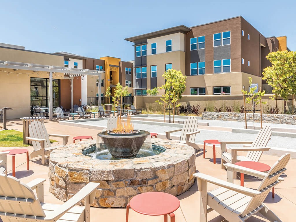 our apartments showcase a naturally well lit courtyard with a fire pit