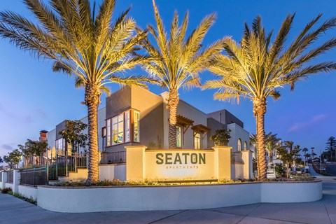 Exterior Monument Sign at Dusk at The Seaton Apartments in San Diego CA