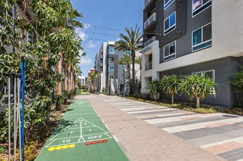 Exterior Paseo Life and Energy Shuffle Board at Aura Apartment Homes in Orange CA - Photo Gallery 47