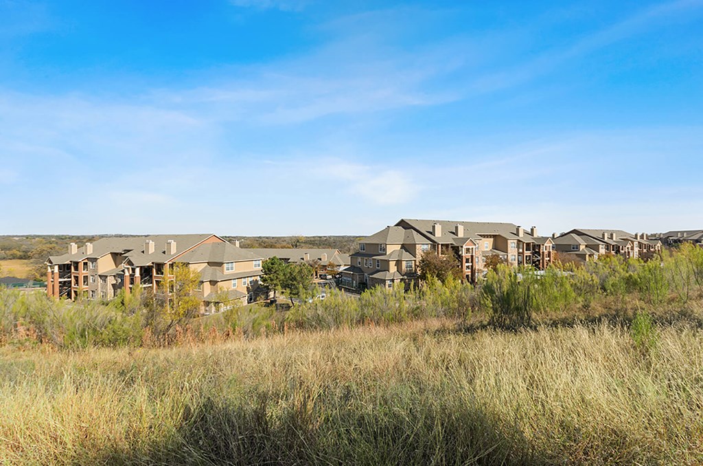 Lush green exterior at Cypress View Villas Apartments in Weatherford TX