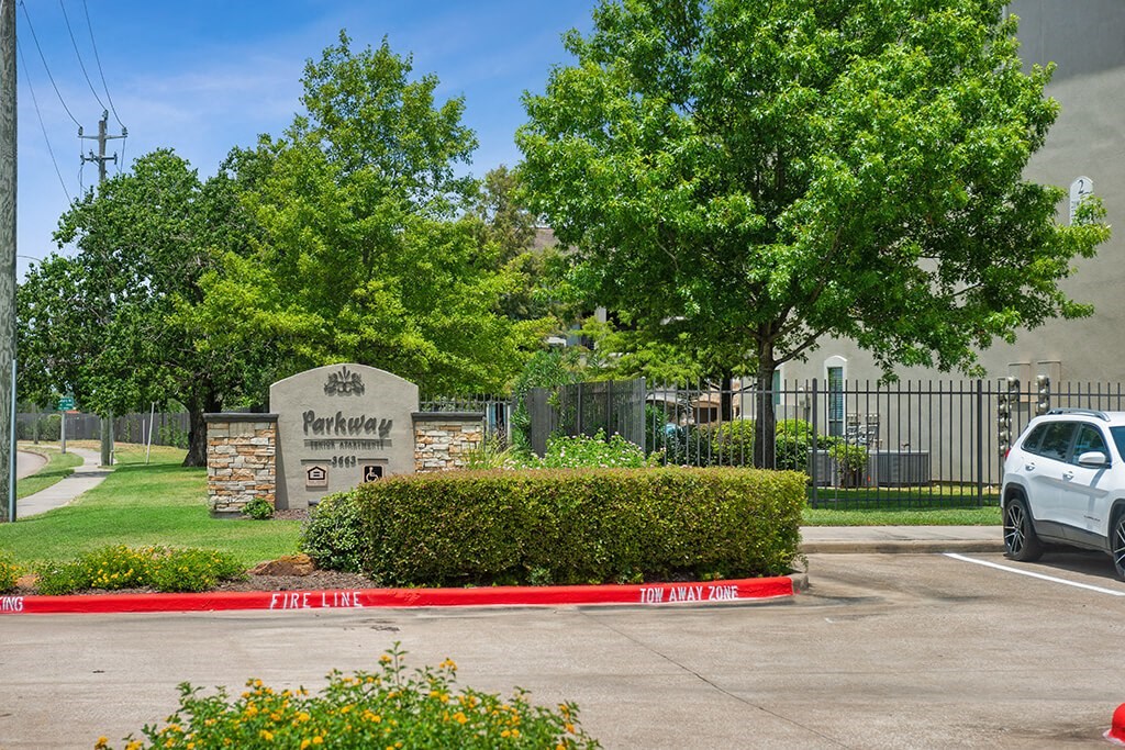 Exterior monument sign at Parkway Senior Apartments in Pasadena TX