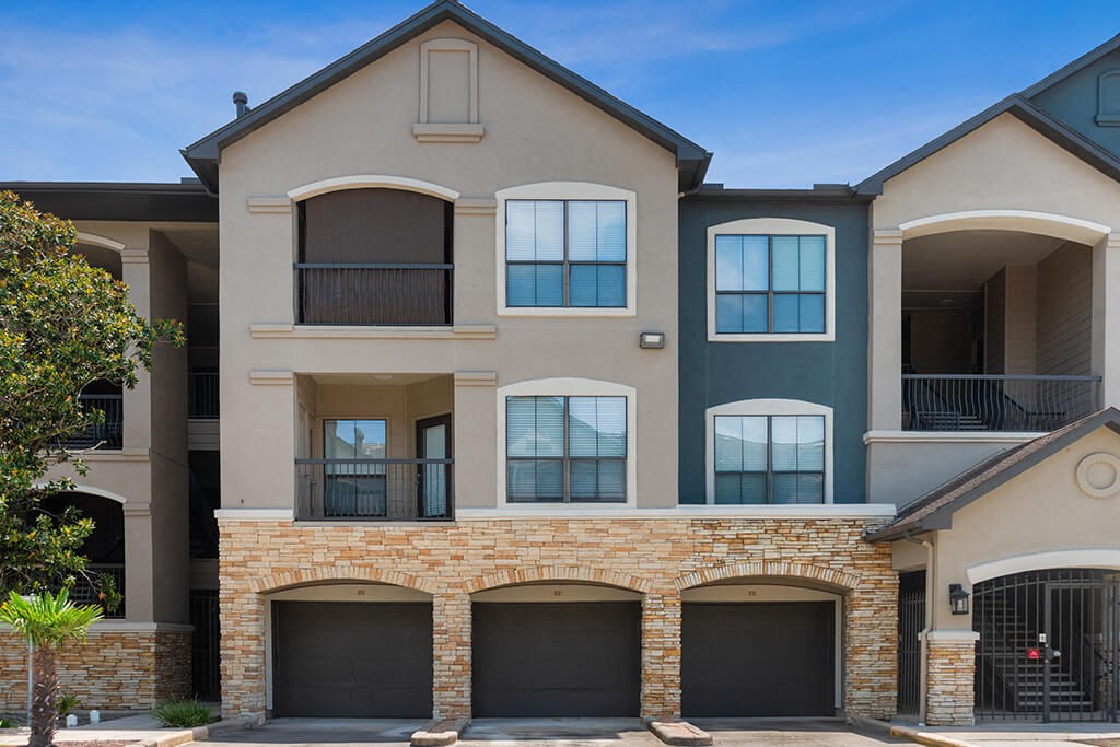 Exterior parking and patio spaces at Parkway Senior at Parkway Senior Apartments in Pasadena TX