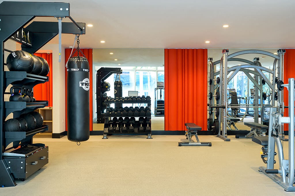 Fitness center weights at Coasterra Apartments in Fort Lauderdale FL