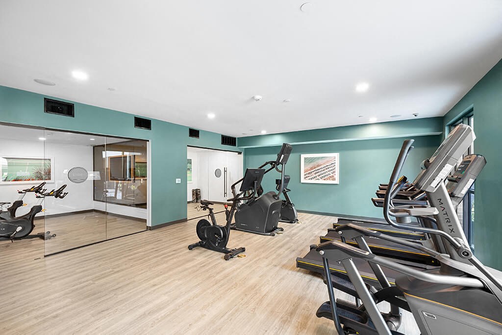 Fitness center cardio machines at East Bend Apartments in Houston TX