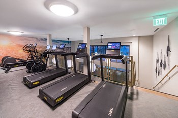 Fitness Center Revive Cardio Equipment at Aura Apartment Homes in Orange CA - Photo Gallery 23