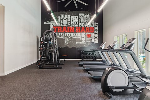 Fitness enter Virtually Staged New Renovated Primary Bedroom at Marquessa Villas Apartmetns and Townhomes in Corona CA 