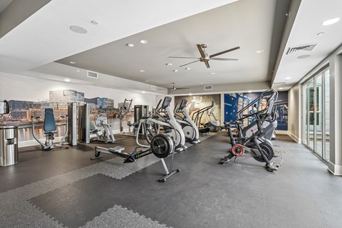 A spacious gym with a variety of exercise equipment.