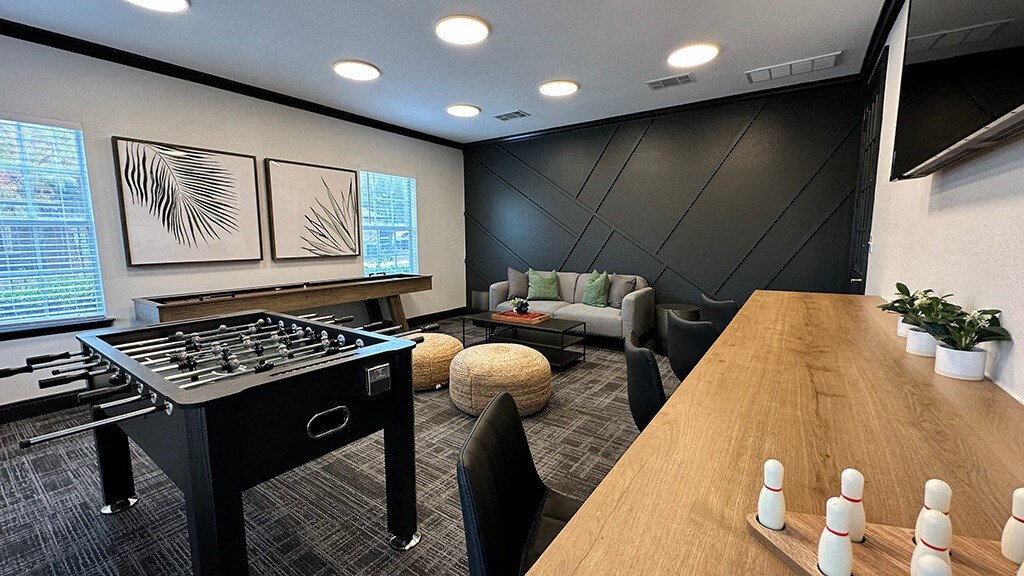 Game room with Foosball table at Cypress View Villas Apartments in Weatherford TX